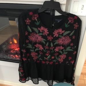 Light and airy embroidered peplum top